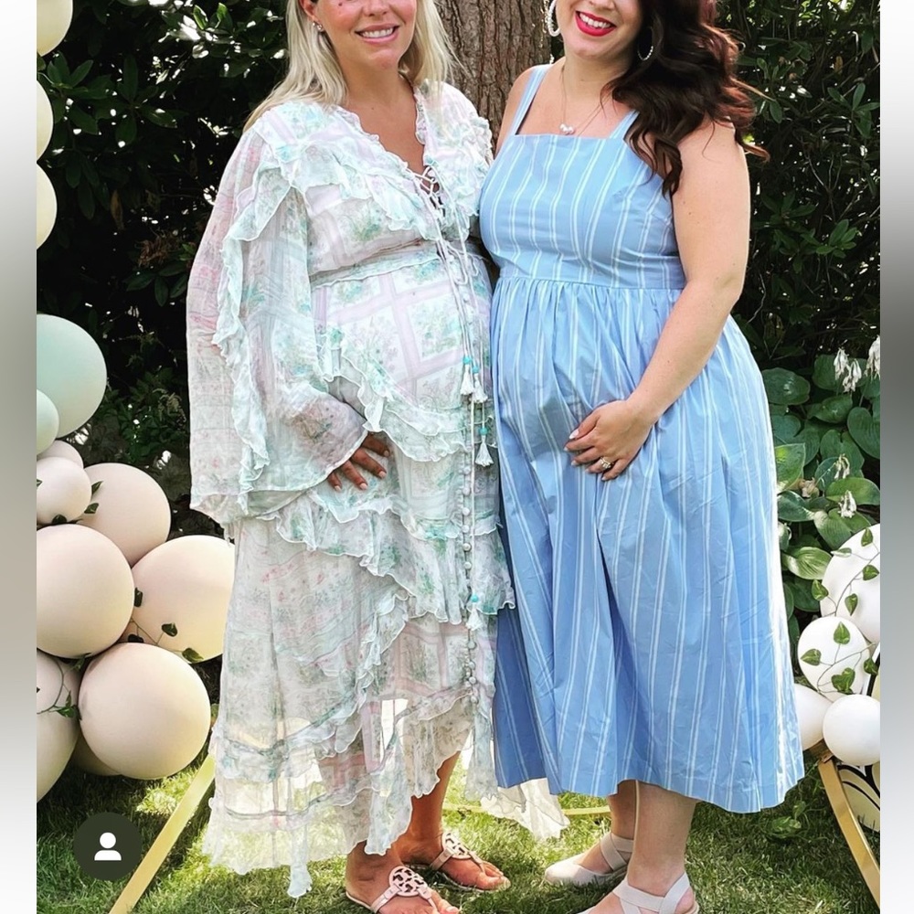 Adorable smocked back midi dress perfect for pregnancy or maternity shoot